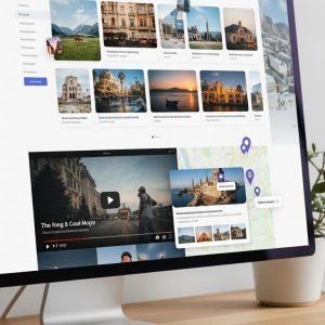 Angled view o f a large computer monitor displaying a grid of various landscape and nature photographs in a gallery layout.